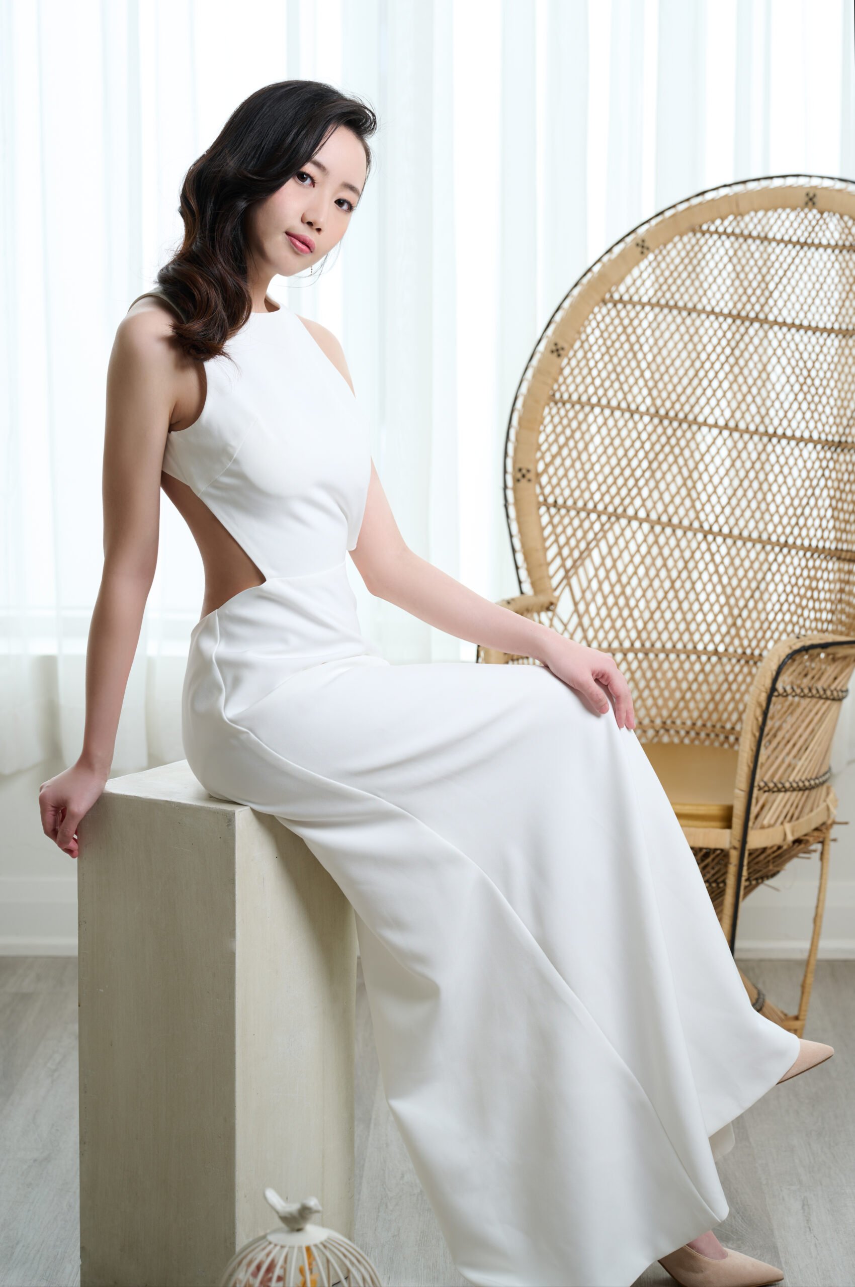 Rent Sara, the modern and sleek wedding dress designed to make you feel confident and beautiful. With a high halter neckline, intricate button back, and daring side cutouts, this gown will turn heads.