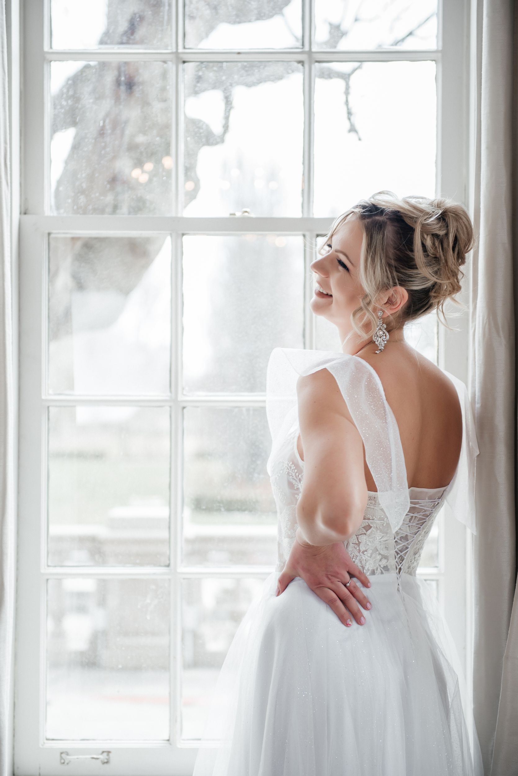 Fairytale boasts an off-shoulder design and sweetheart neckline, accentuated by intricate floral and lovebirds lace appliqués and shimmering sequins on the bodice.