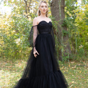 Nova is not just a dress; it's a statement, a celebration of your individuality, and a testament to your extraordinary love story. It is a gown for the bride who chooses to be unapologetically herself and desires a wedding day as unique and extraordinary as her love. Nova, the embodiment of elegance in black, promises to make your wedding day an unforgettable and captivating journey into the depths of enchantment.